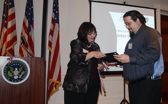 Stamps.com Customer Care Manager Vince Yanez accepts the ATA Call Center Olympics Gold Medal. The event was held at the Richard M. Nixon Library in Yorba Linda, CA.